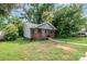 Attractive home featuring a covered front porch and well-manicured lawn at 2312 Tate St, Charlotte, NC 28216