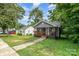 Cozy bungalow with a welcoming front porch and well-maintained lawn at 2312 Tate St, Charlotte, NC 28216