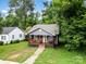 Attractive home featuring a covered front porch and well-manicured lawn at 2312 Tate St, Charlotte, NC 28216
