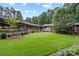 Expansive green lawn with meticulously landscaped beds at 307 E Allenton St, Mount Gilead, NC 27306
