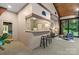 Stylish bar area featuring a countertop with stools and an open layout, creating a perfect entertainment space at 307 E Allenton St, Mount Gilead, NC 27306