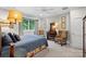 This bedroom features carpet, a large window with trees, and an ornate dresser at 307 E Allenton St, Mount Gilead, NC 27306