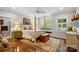 This primary bedroom features a four-poster bed, wood floors, and light gray walls at 307 E Allenton St, Mount Gilead, NC 27306