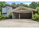 Two-car covered carport with stone accents and additional storage at 307 E Allenton St, Mount Gilead, NC 27306