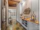 Charming hallway with stone floors, wood ceiling, and decorative art at 307 E Allenton St, Mount Gilead, NC 27306