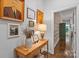 Inviting hallway with wood floors and neutral walls adorned with framed portraits at 307 E Allenton St, Mount Gilead, NC 27306