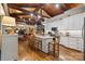Stylish kitchen with white cabinets, granite countertops, and an island with bar seating at 307 E Allenton St, Mount Gilead, NC 27306
