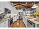 Modern kitchen featuring stainless steel appliances, granite countertops, and ample cabinet space at 307 E Allenton St, Mount Gilead, NC 27306