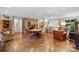 Spacious living room with a stone fireplace, billiard table, and bar area at 307 E Allenton St, Mount Gilead, NC 27306