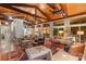 Spacious living room with hardwood floors, vaulted wood ceiling, and an open floor plan at 307 E Allenton St, Mount Gilead, NC 27306