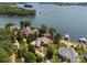 Aerial view featuring home with private lake access, including a boat dock, and waterfront properties along the shoreline at 3996 Channel Point Ln, Denver, NC 28037