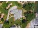 Aerial view highlighting the roof and property layout, featuring landscaping, backyard patio and lake access at 3996 Channel Point Ln, Denver, NC 28037