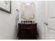 Powder room with an ornate mirror and a dark wood vanity at 3996 Channel Point Ln, Denver, NC 28037