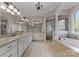 Spacious bathroom featuring a soaking tub and a separate glass shower at 3996 Channel Point Ln, Denver, NC 28037