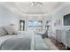 Bright bedroom boasts large windows and water views with a sitting area at 3996 Channel Point Ln, Denver, NC 28037