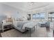 Light and airy bedroom featuring a bench and sitting area with water views at 3996 Channel Point Ln, Denver, NC 28037