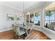 Cozy dining area with scenic water views, natural light, and stylish decor at 3996 Channel Point Ln, Denver, NC 28037