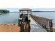 Waterfront property featuring a private dock with a covered gazebo, offering access and views of the lake at 3996 Channel Point Ln, Denver, NC 28037