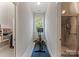 Workout area with stationary bike and weights located between a closet and glass enclosed shower at 3996 Channel Point Ln, Denver, NC 28037