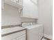 Laundry room featuring a washing machine, dryer, and a utility sink at 3996 Channel Point Ln, Denver, NC 28037