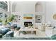 Bright living room with high ceilings, built-in bookshelves, fireplace, and stylish furniture at 3996 Channel Point Ln, Denver, NC 28037