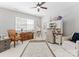Bright office space features a desk, shelving, and comfortable seating at 3996 Channel Point Ln, Denver, NC 28037