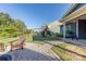 The backyard boasts a charming playhouse and swing set, providing endless fun for children at 4113 Bent Green Ln, Monroe, NC 28112