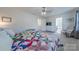 Spacious bedroom featuring neutral carpet, a dresser, sitting chair and easy access to bathroom at 4113 Bent Green Ln, Monroe, NC 28112