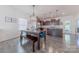 Bright dining area featuring a modern chandelier, wood table, and an open layout connecting to the kitchen at 4113 Bent Green Ln, Monroe, NC 28112