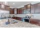Close-up of updated kitchen with stainless steel appliances, granite countertops and a kitchen island at 4113 Bent Green Ln, Monroe, NC 28112