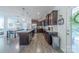Well-designed kitchen featuring granite counters, dark cabinets, stainless appliances, and hardwood flooring at 4113 Bent Green Ln, Monroe, NC 28112
