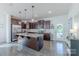 Modern kitchen features granite countertops, dark wood cabinets, stainless appliances, and hardwood floors at 4113 Bent Green Ln, Monroe, NC 28112