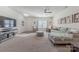 Spacious living room with plush carpet, modern furnishings, and plenty of natural light at 4113 Bent Green Ln, Monroe, NC 28112