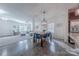 Open-concept living space with wood floors, and an adjacent sitting area filled with natural light at 4113 Bent Green Ln, Monroe, NC 28112