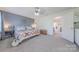 Comfortable bedroom with soft natural light, and doorway access to en-suite bathroom at 4113 Bent Green Ln, Monroe, NC 28112