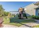Backyard playhouse with swing set and slide is perfect for outdoor fun and activities at 4113 Bent Green Ln, Monroe, NC 28112
