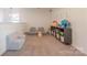 Bright playroom with carpet, a comfortable seating area, and organized storage for toys and books at 4113 Bent Green Ln, Monroe, NC 28112
