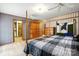 This spacious bedroom features a wooden bed frame, hardwood floors, a patterned ceiling, and vintage décor at 4412 Dobys Bridge Rd, Fort Mill, SC 29707