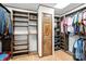 Spacious walk-in closet with custom shelving and wooden door provides ample storage for clothing and accessories at 4412 Dobys Bridge Rd, Fort Mill, SC 29707