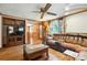 This spacious living room features wood floors, a large sectional sofa, and a vintage grandfather clock at 4412 Dobys Bridge Rd, Fort Mill, SC 29707