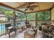 Relaxing screened porch with comfortable seating, perfect for enjoying the outdoors bug-free at 4412 Dobys Bridge Rd, Fort Mill, SC 29707