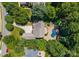 An aerial view of the property, featuring a private pool, patio, and lush landscaping at 4536 Rustling Woods Dr, Denver, NC 28037