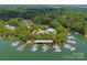 Aerial view of boat slips on the lake in a lush wooded community at 4536 Rustling Woods Dr, Denver, NC 28037