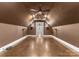 Bonus room featuring neutral paint, a unique floor, ceiling fan, mounted sconces and an abundance of space at 4536 Rustling Woods Dr, Denver, NC 28037