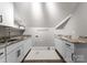 Practical laundry room features bright lighting, counter space, a utility sink, and a shower pan for cleaning tasks at 4536 Rustling Woods Dr, Denver, NC 28037