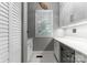 Bright pantry features white cabinets, marble floors, quartz counters, and a wine fridge, adding elegance and functionality at 4536 Rustling Woods Dr, Denver, NC 28037
