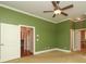 Spacious bedroom with carpet, ceiling fan, and white trim at 458 Leaf Arbor Ct, Clover, SC 29710