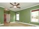 Comfortable bedroom features two windows and crown moulding at 458 Leaf Arbor Ct, Clover, SC 29710