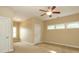 Bedroom with carpet, ceiling fan, three windows, and neutral colored walls at 458 Leaf Arbor Ct, Clover, SC 29710