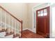 Welcoming foyer with hardwood floors, staircase, and sidelight windows by the door at 458 Leaf Arbor Ct, Clover, SC 29710